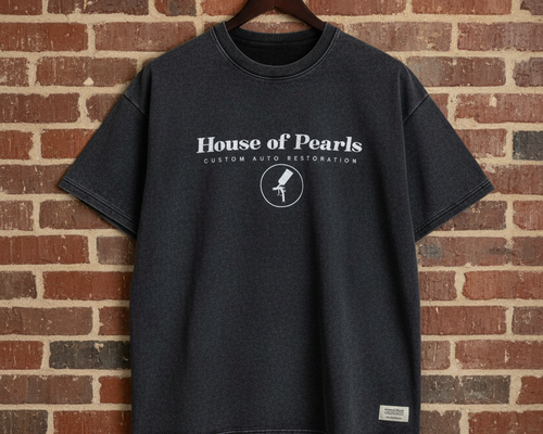 House of Pearls t-shirt with patch detail against brick wall